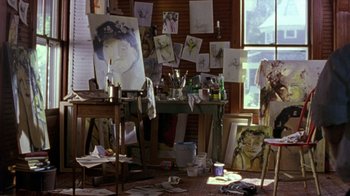 Movie still from “The Station Agent” (2003), directed by Tom McCarthy – An artist's studio filled with lots of art supplies; Wide shot, High angle