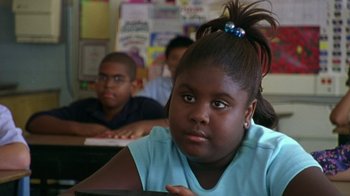 Movie still from “The Station Agent” (2003), directed by Tom McCarthy – A young girl sitting in front of a group of other young people; Close Up shot, High angle