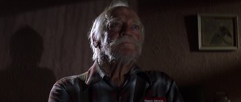 Movie still from “The Straight Story” (1999), directed by David Lynch – An old man with a beard and a mustache; Close Up shot, Low angle