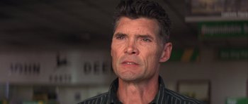 Movie still from “The Straight Story” (1999), directed by David Lynch – A person looking at the camera; Close Up shot, Low angle