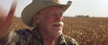 Movie still from “The Straight Story” (1999), directed by David Lynch – An old man with a cowboy hat and a beard; Close Up shot, Low angle