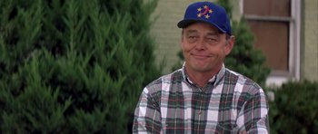 Movie still from “The Straight Story” (1999), directed by David Lynch – A person wearing a hat; Close Up shot, Low angle