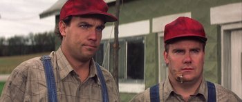 Movie still from “The Straight Story” (1999), directed by David Lynch – A couple of men standing next to each other; Close Up shot, Low angle