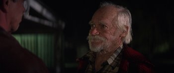 Movie still from “The Straight Story” (1999), directed by David Lynch – An old man with a beard and a plaid shirt; Close Up shot, Low angle