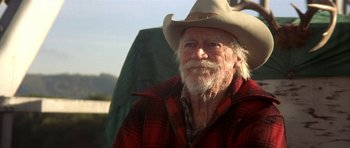 Movie still from “The Straight Story” (1999), directed by David Lynch – An old man with a cowboy hat and a beard; Close Up shot, Low angle