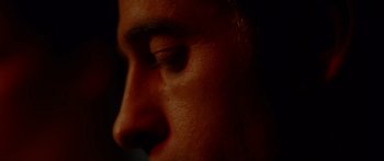 Movie still from “The Strangers” (2008), directed by Bryan Bertino – A man's face with dark lighting; Extreme Close Up shot, High angle