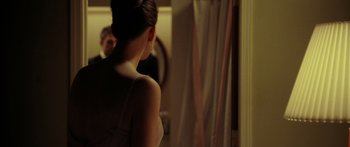 Movie still from “The Strangers” (2008), directed by Bryan Bertino – A woman standing in front of a bathroom mirror; Medium shot, Over the shoulder angle