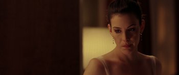 Movie still from “The Strangers” (2008), directed by Bryan Bertino – A person wearing a white shirt; Close Up shot, Over the shoulder angle