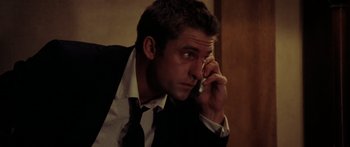 Movie still from “The Strangers” (2008), directed by Bryan Bertino – A person talking on a cell phone; Close Up shot, Low angle