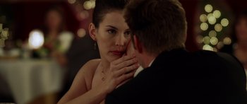 Movie still from “The Strangers” (2008), directed by Bryan Bertino – A man and a woman touching their faces; Close Up shot, Over the shoulder angle