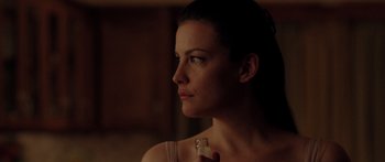 Movie still from “The Strangers” (2008), directed by Bryan Bertino – A beautiful woman holding a bottle in her hand; Close Up shot, Over the shoulder angle