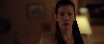 Movie still from “The Strangers” (2008), directed by Bryan Bertino – A person with long hair; Close Up shot, Over the shoulder angle