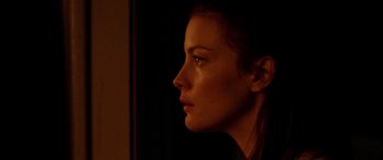 Movie still from “The Strangers” (2008), directed by Bryan Bertino – A person looking to the side; Close Up shot, Over the shoulder angle