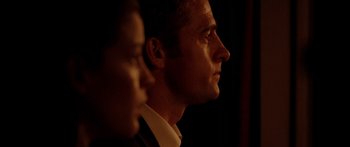 Movie still from “The Strangers” (2008), directed by Bryan Bertino – A man and a woman looking into the distance; Close Up shot, Low angle