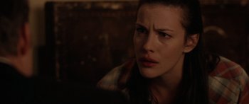 Movie still from “The Strangers” (2008), directed by Bryan Bertino – A person with her eyes wide open; Close Up shot, Over the shoulder angle