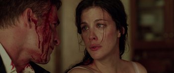 Movie still from “The Strangers” (2008), directed by Bryan Bertino – A young woman crying next to a young man; Close Up shot, Over the shoulder angle