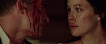 Movie still from “The Strangers” (2008), directed by Bryan Bertino – A man and a woman face to face with blood on their face; Close Up shot, Over the shoulder angle