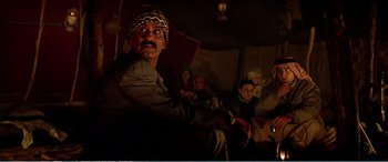 Movie still from “The Sum of All Fears” (2002), directed by Phil Alden Robinson – A group of people sitting in a room; Medium shot, Over the shoulder angle