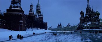 Movie still from “The Sum of All Fears” (2002), directed by Phil Alden Robinson – People are walking on the snow near a cathedral; Extreme Wide shot, High angle