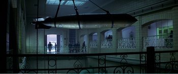 Movie still from “The Sum of All Fears” (2002), directed by Phil Alden Robinson – A group of people standing on a balcony; Extreme Wide shot, High angle