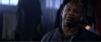 Movie still from “The Sum of All Fears” (2002), directed by Phil Alden Robinson – A person wearing a plaid shirt; Close Up shot, Low angle