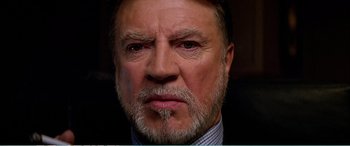 Movie still from “The Sum of All Fears” (2002), directed by Phil Alden Robinson – An older man with a beard and mustache; Close Up shot, Low angle