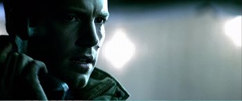 Movie still from “The Sum of All Fears” (2002), directed by Phil Alden Robinson – A man's face in front of a bright light; Close Up shot, Over the shoulder angle
