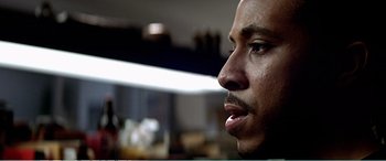 Movie still from “The Sum of All Fears” (2002), directed by Phil Alden Robinson – A man's face in a room; Close Up shot, Low angle