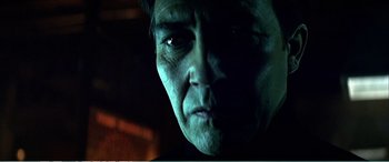 Movie still from “The Sum of All Fears” (2002), directed by Phil Alden Robinson – A man's face in the dark; Close Up shot, Low angle