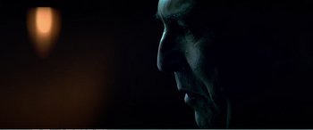 Movie still from “The Sum of All Fears” (2002), directed by Phil Alden Robinson – A man's face in the dark; Extreme Close Up shot, Low angle