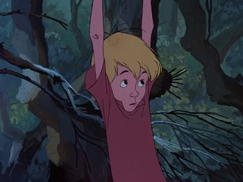 Movie still from “The Sword in the Stone” (1963), directed by Wolfgang Reitherman – A young boy hanging from a tree in the woods; Medium shot, Low angle
