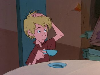 Movie still from “The Sword in the Stone” (1963), directed by Wolfgang Reitherman – A boy is drinking a cup of tea at a table; Close Up shot, High angle