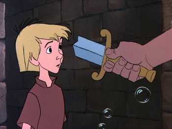 Movie still from “The Sword in the Stone” (1963), directed by Wolfgang Reitherman – A cartoon picture of a knife being held by a person; Medium shot, Over the shoulder angle