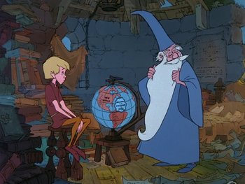 Movie still from “The Sword in the Stone” (1963), directed by Wolfgang Reitherman – A man in a blue robe is standing next to a globe; Wide shot, High angle