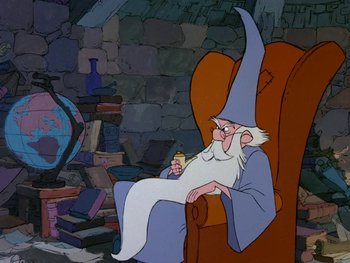 Movie still from “The Sword in the Stone” (1963), directed by Wolfgang Reitherman – An old wizard sitting in a chair holding a book in his hand; Medium shot, High angle