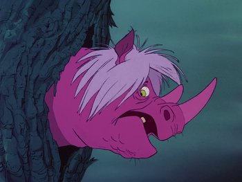 Movie still from “The Sword in the Stone” (1963), directed by Wolfgang Reitherman – A pink rhinoceroses head in a tree trunk; Close Up shot, Low angle