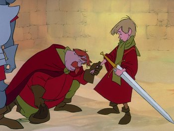 Movie still from “The Sword in the Stone” (1963), directed by Wolfgang Reitherman – Two cartoon characters are fighting each other with a sword; Medium shot, Low angle