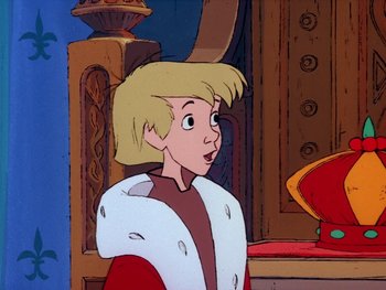Movie still from “The Sword in the Stone” (1963), directed by Wolfgang Reitherman – A young blonde haired boy wearing a white fur coat; Close Up shot, Over the shoulder angle