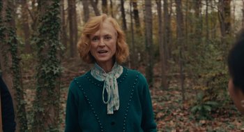 Movie still from “The Taking of Deborah Logan” (2014), directed by Adam Robitel – A woman with red hair standing in the woods; Medium shot, Low angle