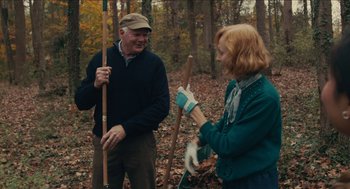 Movie still from “The Taking of Deborah Logan” (2014), directed by Adam Robitel – A man and a woman in the woods holding sticks; Medium shot, Over the shoulder angle