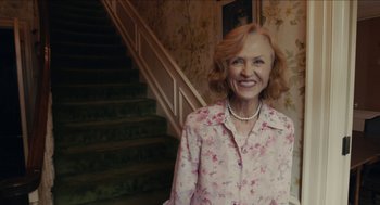 Movie still from “The Taking of Deborah Logan” (2014), directed by Adam Robitel – An older woman standing in front of a staircase; Medium shot, Low angle