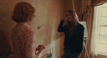 Movie still from “The Taking of Deborah Logan” (2014), directed by Adam Robitel – Two women standing next to each other in front of a wall; Medium shot, Over the shoulder angle