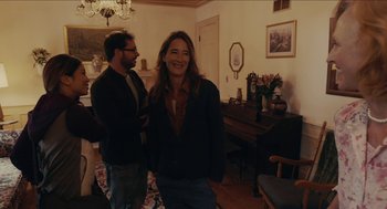 Movie still from “The Taking of Deborah Logan” (2014), directed by Adam Robitel – A man and a woman standing in a living room; Medium shot, Over the shoulder angle