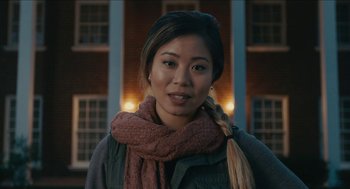 Movie still from “The Taking of Deborah Logan” (2014), directed by Adam Robitel – A woman wearing a scarf and a jacket; Close Up shot, Low angle