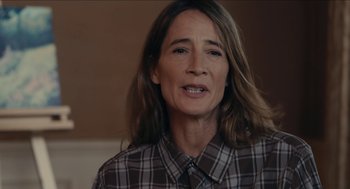 Movie still from “The Taking of Deborah Logan” (2014), directed by Adam Robitel – A person wearing a plaid shirt; Close Up shot, Over the shoulder angle