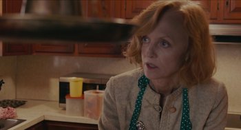Movie still from “The Taking of Deborah Logan” (2014), directed by Adam Robitel – An older woman wearing an apron in a kitchen; Close Up shot, High angle