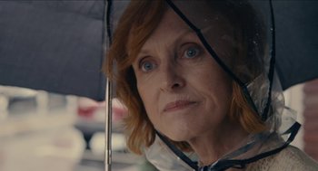 Movie still from “The Taking of Deborah Logan” (2014), directed by Adam Robitel – A person holding an open umbrella; Close Up shot, Over the shoulder angle