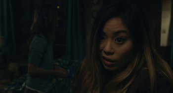 Movie still from “The Taking of Deborah Logan” (2014), directed by Adam Robitel – A woman with long black hair is looking at the camera; Close Up shot, Over the shoulder angle