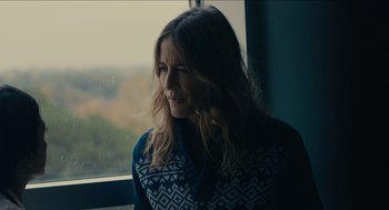 Movie still from “The Taking of Deborah Logan” (2014), directed by Adam Robitel – A woman looking out of a window at the sky; Close Up shot, Over the shoulder angle