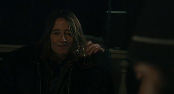 Movie still from “The Taking of Deborah Logan” (2014), directed by Adam Robitel – A woman is holding a glass of wine; Close Up shot, Over the shoulder angle